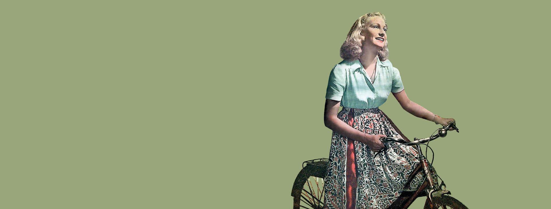 Femme sur bicyclette sur fond vert 